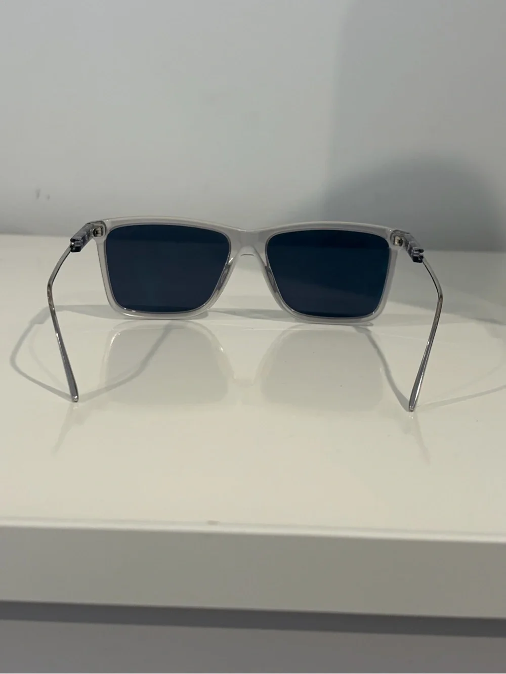 Prada Men’s Clear Frame Sunglasses with Dark Blue Lenses